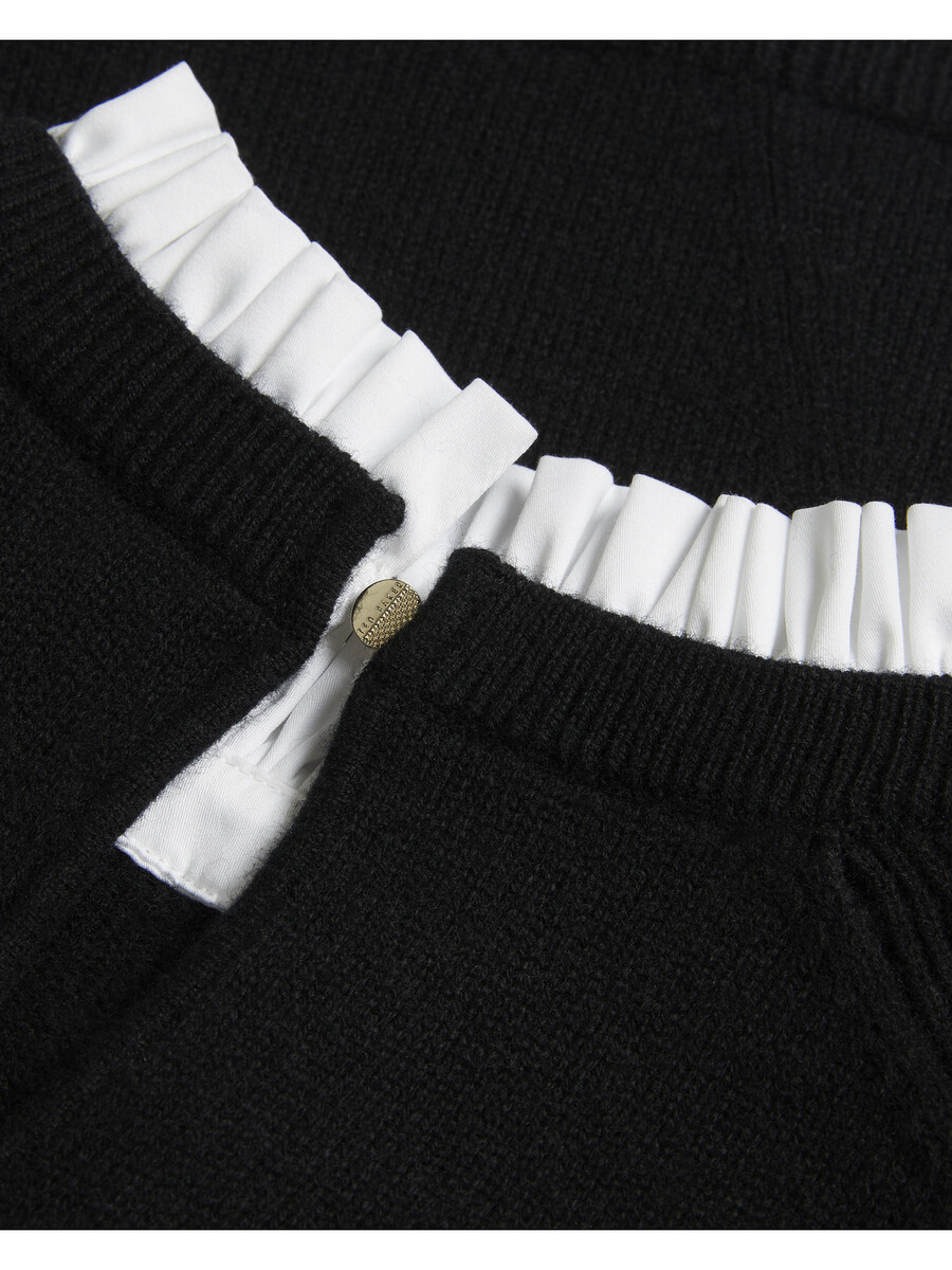 lissiah - jersey de punto con dobladillo de camisa y detalle de pompones